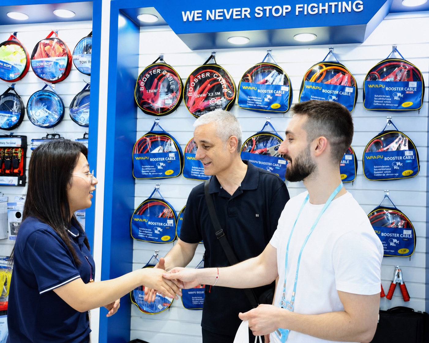 WANPU team greeting international automotive buyers at a trade show